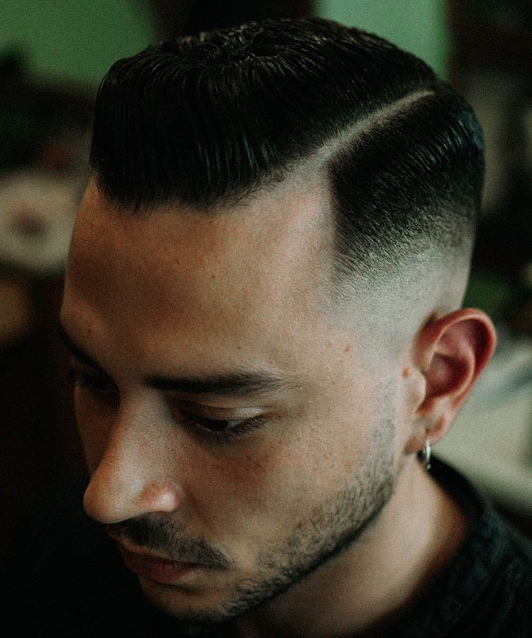 Hairstyle like a me - Modern Pompadour + Skin Fade: Standout style can come  from contrasts or repetition. This cut achieves the latter with a shaved  line that mirrors the arch of