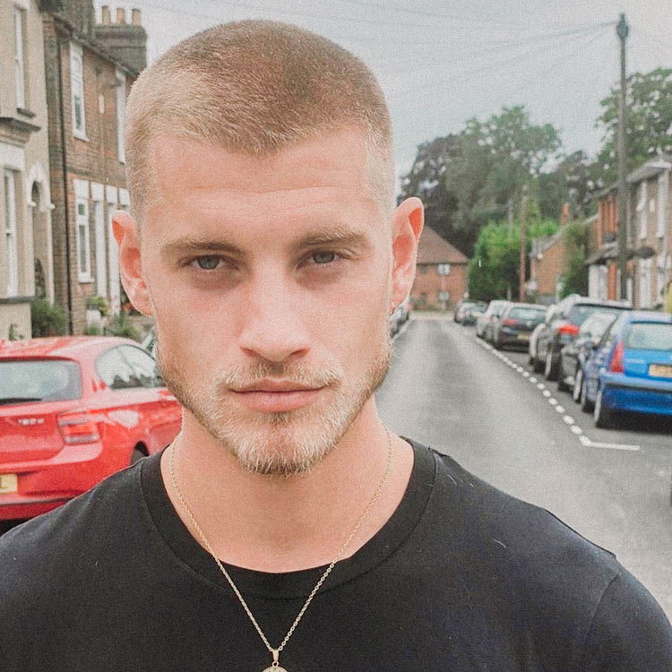 Men's fashion haircut created with clippers around the head