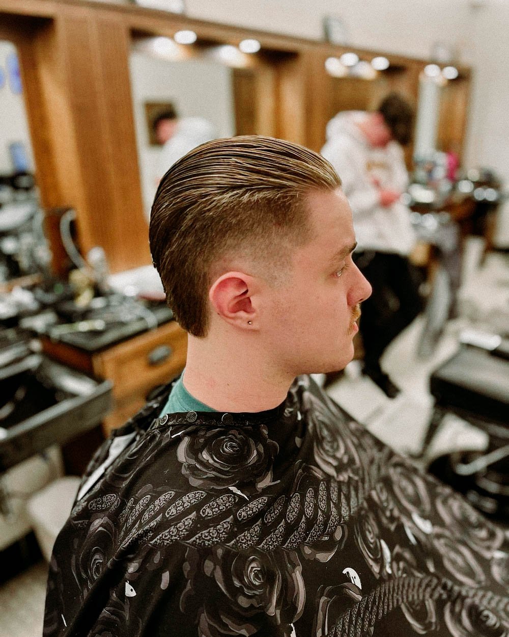 Men Hairstyles - 5. Sweep Back The sweep back has a similar profile to slicked  back hair but has a more tousled, windswept finish. That works really well  for medium men's hair